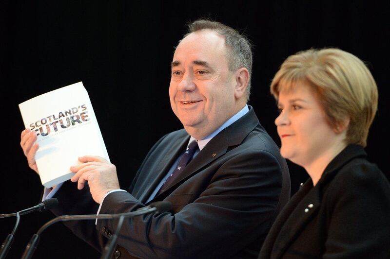 Scottish first minister Alex Salmond, left, and deputy first minister Nicola Sturgeon present the White Paper for Scottish independance at the Science Museum Glasgow. Jeff J Mitchell / Getty Images