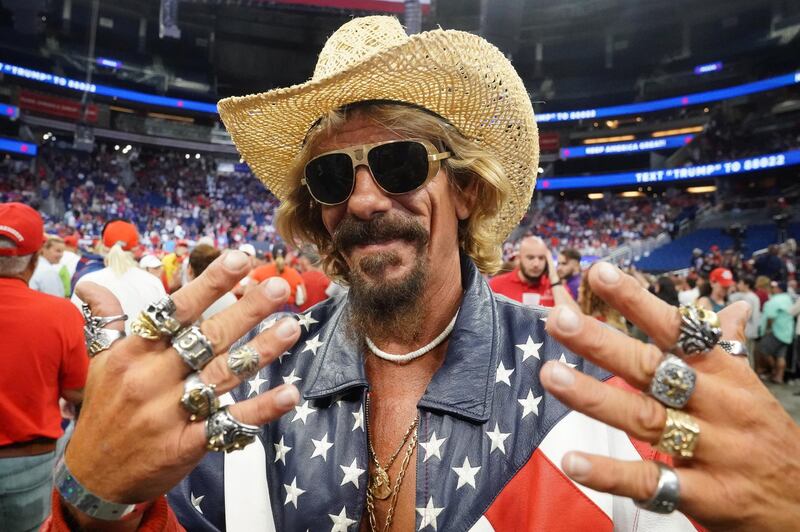 A supporter poses for photo before Donald Trump holds a campaign kick off rally at the Amway Center in Orlando, Florida.  Reuters