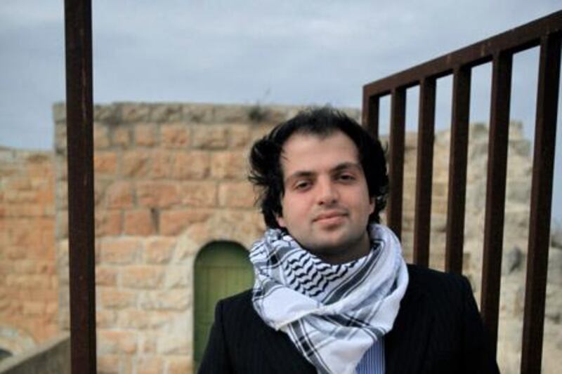 Fadi Quran, 22, stands in front of of his grandparents home in Al Bireh.
Photo By: Tamara Abdul Hadi
Date: January 27, 2011