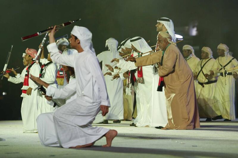 Emirati men performing the traditional dance  during the 42nd National Day celebrations.  Antonie Robertson/The National