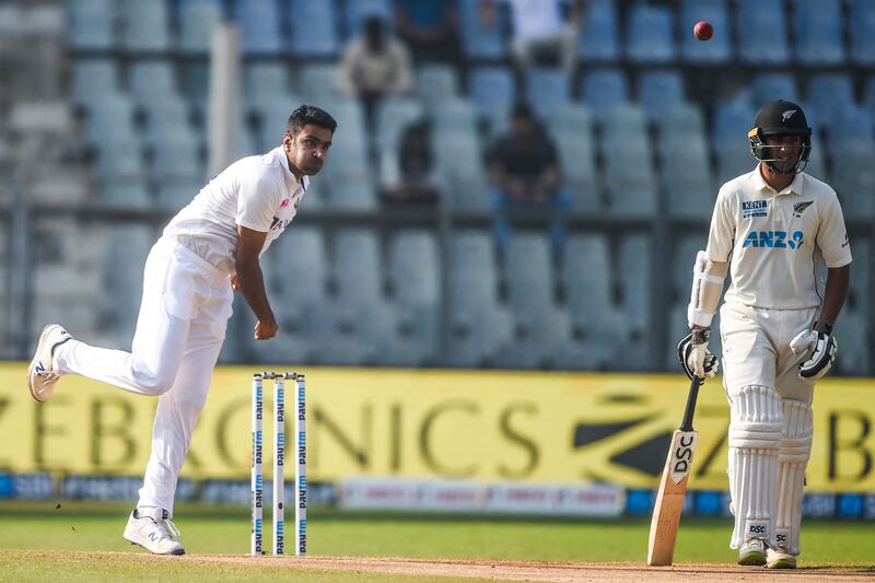 India bowler Ravichandran Ashwin delivers a ball as New Zealand's Rachin Ravindra watches. AFP