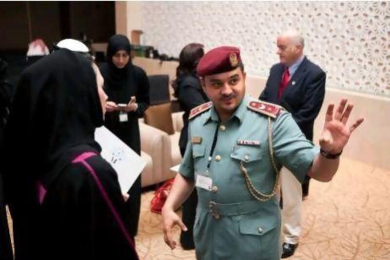 Lt. Col. Faisal Mohammed Al Shamari, Director of the Ministry of Interior's Child Protection Centre, talks with Samia Kazi, COO of Arabian Child, after a debate titled Hidden Scars: A Forum About Child Abuse.