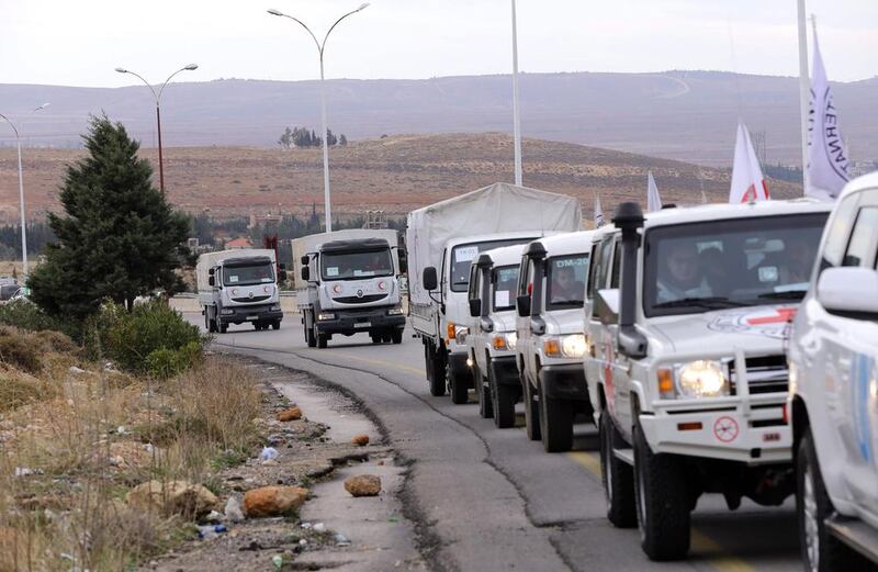 Aid convoys head from Damascus to the besieged town of Madaya last year. Louai Beshara / AFP