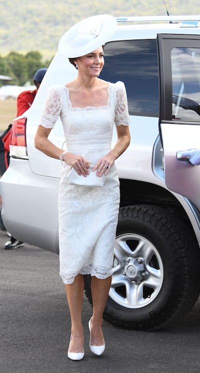 Catherine, Duchess of Cambridge, in white Alexander McQueen, arrives for the Caribbean Military Academy commissioning parade in Kingston, Jamaica, on March 24, 2022. AFP 