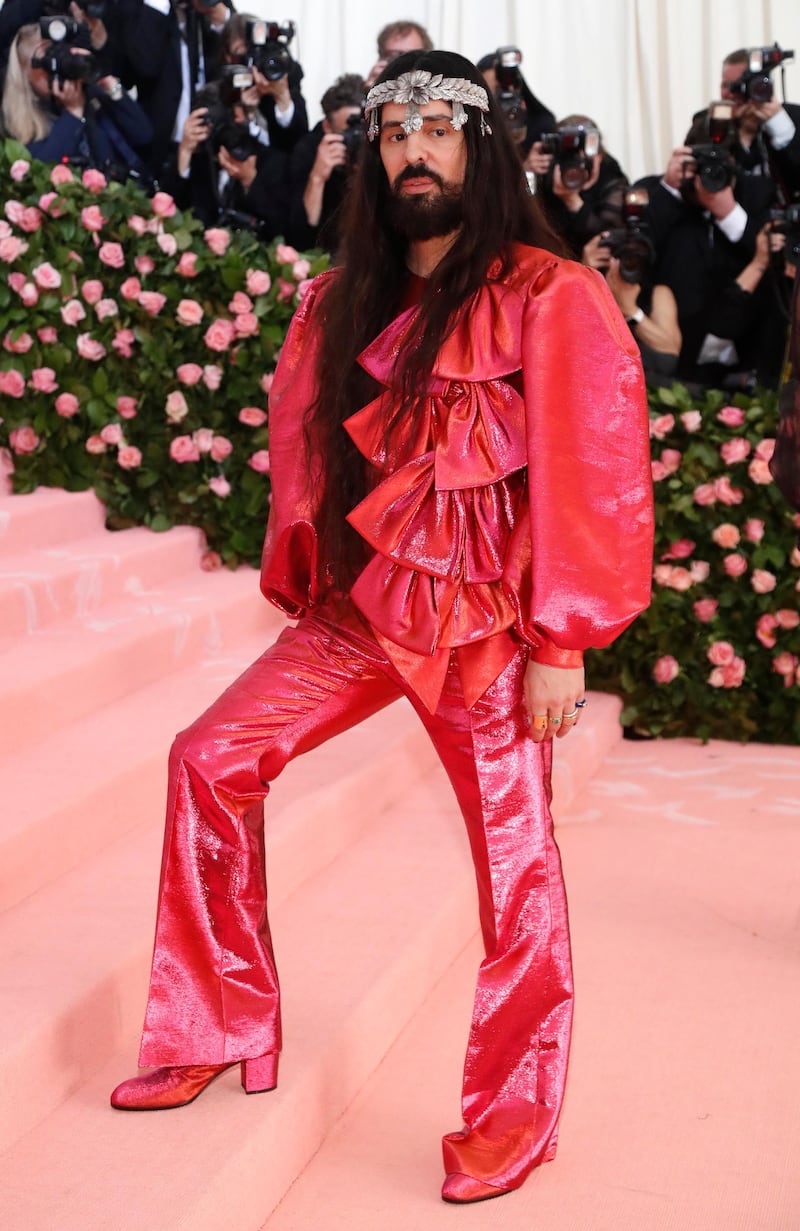 Alessandro Michele of Gucci wore a pink ruffled satin top and trousers, and even wore hair extensions for the night. Reuters