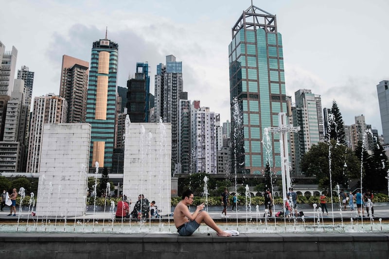 A man sits next to a fountain at the Sun Yat Sen Memorial Park in Hong Kong on April 21, 2020. Hong Kong has reduced growth of confirmed COVID-19 cases to single digits in recent days, but city authorities say they are not taking any risks. Chief executive Carrie Lam said social distancing measures and some business restrictions would continue for another two weeks until at least May 7.   AFP