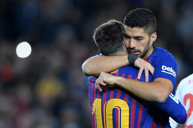 Lionel Messi, left, and Luis Suarez, celebrate. AFP