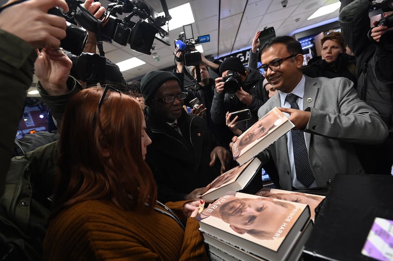 The first copies of Prince Harry's new book Spare are unpacked during a midnight sale at a book shop in London. EPA