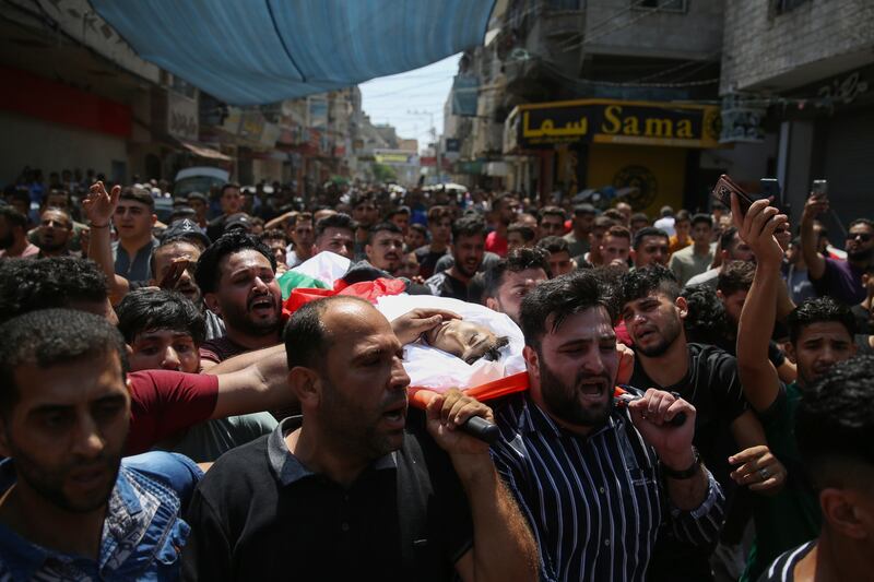 Mourners carry the body of a Palestinian killed in an explosion at Jebaliya refugee camp near the northern Gaza Strip. AP