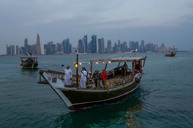 A traditional dhow boat sails at the corniche in Doha. AP Photo