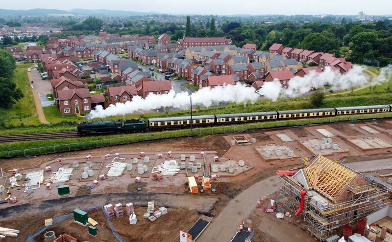 A steam train from the Great Central Railway passes between new housing developments in Loughborough, UK. Britain's housing market accelerated after finance minister Rishi Sunak unveiled a tax break in July last year. Bloomberg