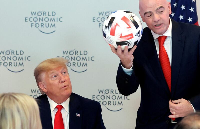 U.S. President Donald Trump listens to FIFA President Gianni Infantino speak during a dinner with global CEOs during the 50th World Economic Forum (WEF) annual meeting in Davos, Switzerland, January 21, 2020. REUTERS/Jonathan Ernst