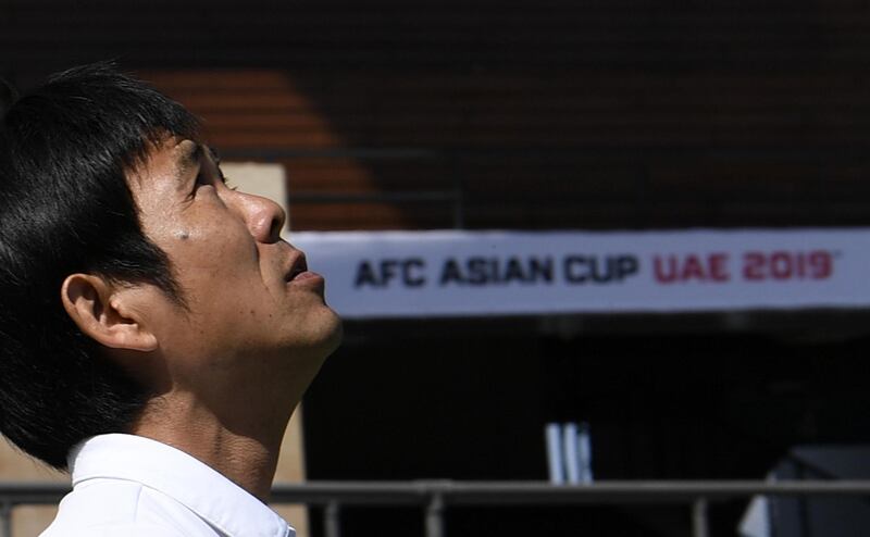 Japan's head coach Hajime Moriyasu arrives for a photo session at the Zayed Sports City Stadium in Abu Dhabi ahead of their Asian Cup's final football match. AFP