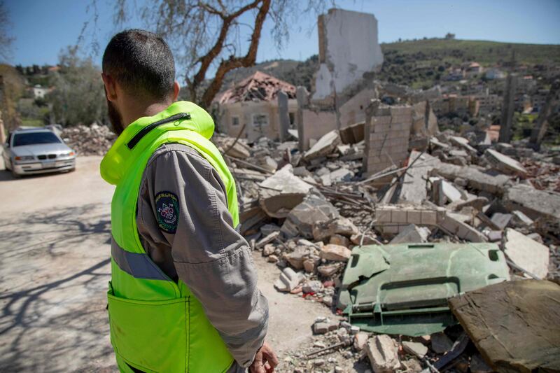 A paramedic at the site of an Israeli air strike in the southern Lebanese village of Odaisseh near the border with Israel. AFP