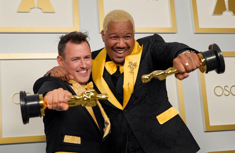 Martin Desmond Roe, left, and Travon Free pose with their award for Best Live Action Short Film for 'Two Distant Strangers' in the press room at the Academy Awards in Los Angeles, California. AP