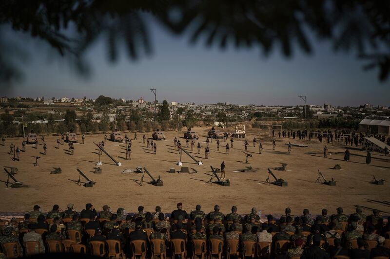 Fatah militants display their weapons during a rally in Khan Younis, southern Gaza Strip. AP