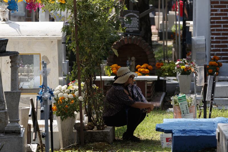 Hundreds of people honour their dead relatives at the Xilotepec Pantheon, in Mexico City. EPA