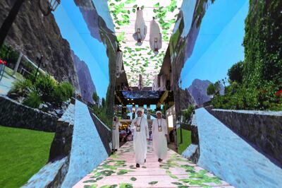 Visitors take a scenic route at Arabian Travel Market in Dubai. Victor Besa / The National