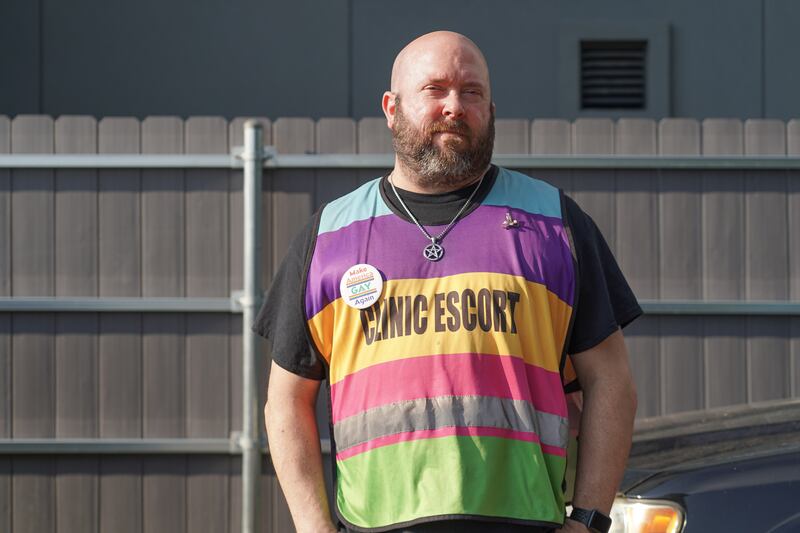 A clinic escort stands outside the Jackson Women's Health Organisation, known as the Pink House. Willy Lowry / The National 