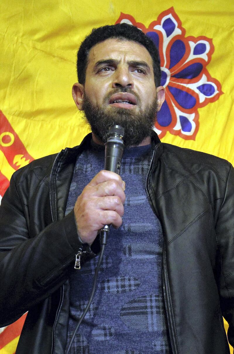 A picture taken on January 26, 2017 shows Mahmoud Mustafa Busayf al-Werfalli speaking in the eastern Libyan city of Benghazi. 
The International Criminal Court has issued an arrest warrant Werfalli, a military commander in Benghazi for the deaths of 33 people, whom he is accused of personally murdering or giving the orders for their murders. / AFP PHOTO / Abdullah DOMA