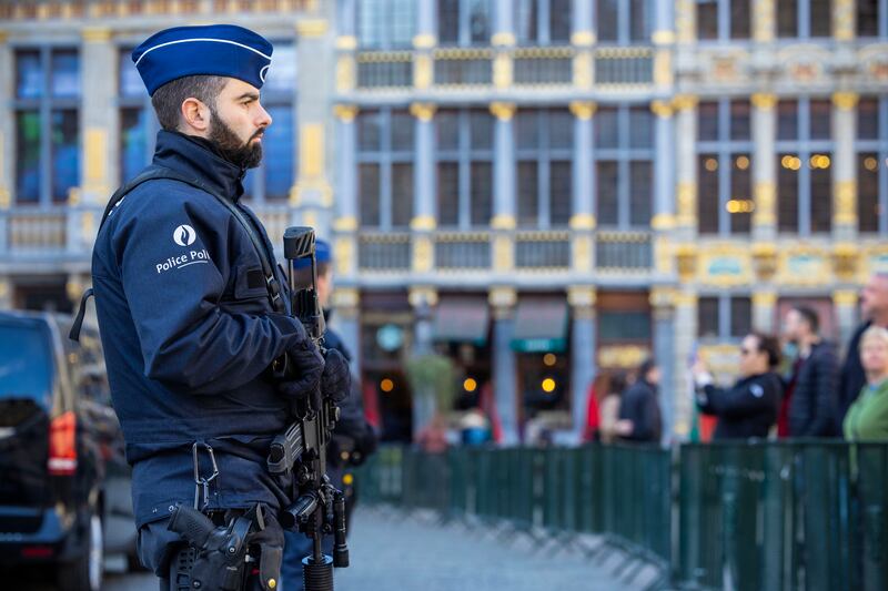 Belgian police officers secure Grand-Place square in Brussels after two Swedish football fans were shot dead on October 17. EPA