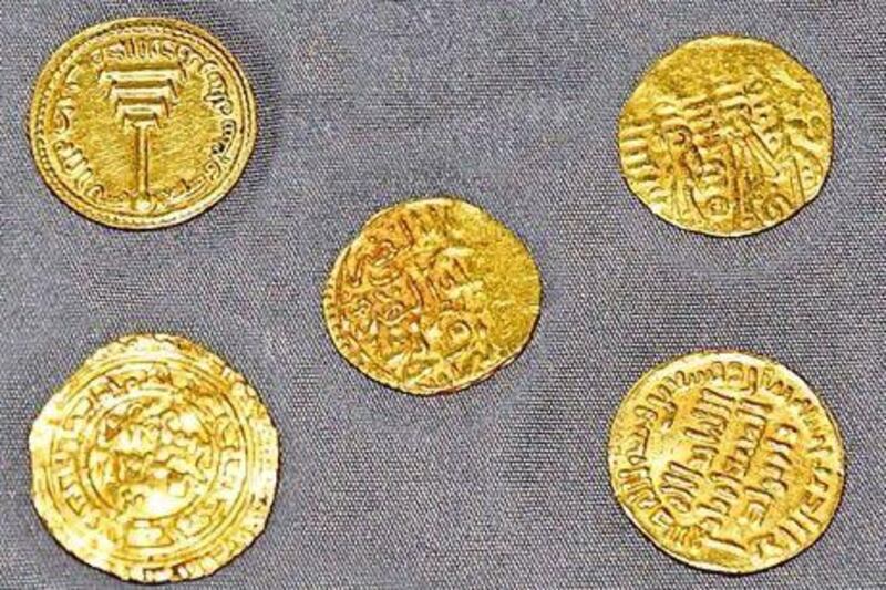 The five antique coins - four authentic, one fake - seized by Abu Dhabi police. Courtesy Abu Dhabi Police