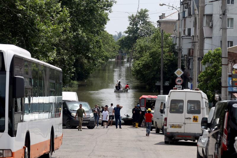 Boats evacuate residents from a flooded area in Kherson, Ukraine. AFP