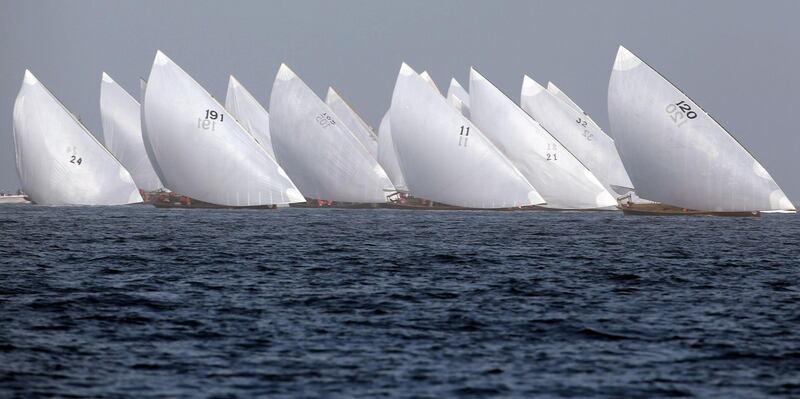 Dhows participate in the al-Gaffal traditional long-distance dhow sailing race near the island of Sir Bu Nair towards Dubai, on May 14, 2017. Over a hundred traditional dhow racing boats are taking part in al-Gaffal race from Sir Bu Nayer Island to Dubai. / AFP / Karim SAHIB
