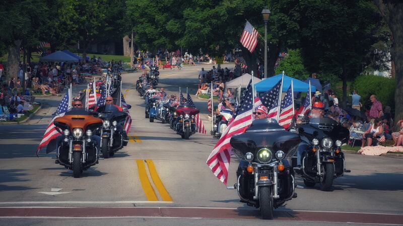 Flag-bearing Fourth of July revellers rumble through the streets of middle America. Photo: Ken Mattison