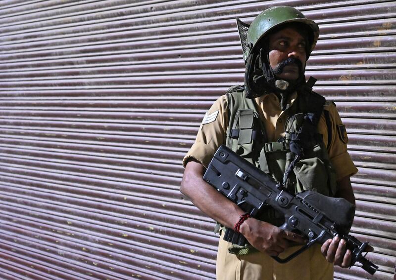 An Indian paramilitary trooper stands guard at a roadblock at Maisuma locality in Srinagar on August 4, 2019. AFP