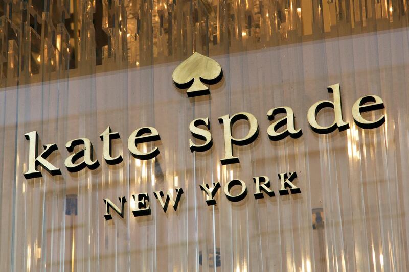 The Kate Spade logo is shown at her Madison Avenue store, Tuesday, June 5, 2018, in New York. Law enforcement officials say Spade has been found dead in her apartment in an apparent suicide. (AP Photo/Mark Lennihan)