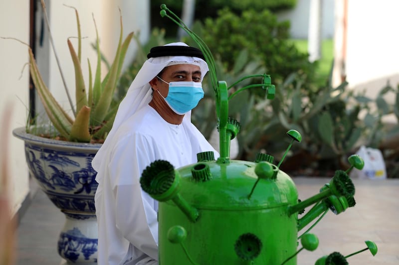 Ras Al Khaimah, United Arab Emirates - Reporter: N/A: Artist Tariq Al Salmon with his Covid-19 sculpture in Ras Al Khaimah. Tuesday, May 19th, 2020. Ras Al Khaimah. Chris Whiteoak / The National