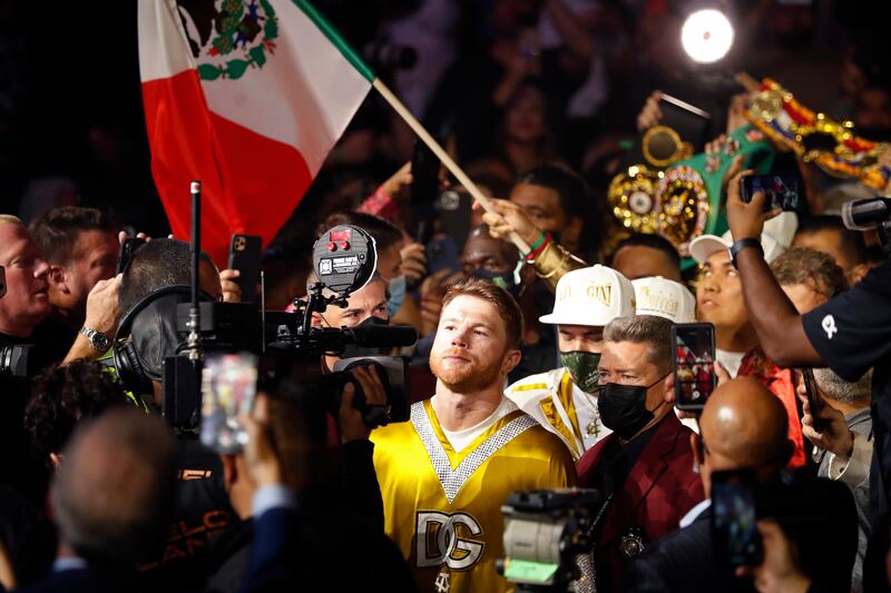 Canelo Alvarez, of Mexico, enters the arena. AP Photo