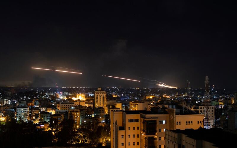 Rockets launched from the Gaza Strip streak towards Israel. AP