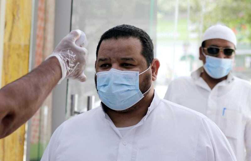 Shoppers have their temperatures checked before entering a mall in Jiddah, Saudi Arabia, Monday, June 15, 2020. This was supposed to be Saudi Arabia's year to shine as host of the prestigious G20 gathering of world leaders. Instead, due to the coronavirus pandemic, the gathering this November will likely be a virtual meet-up. The impact of the coronavirus and low oil prices have forced a recalibration of Prince Mohammed bin Salmanâ€™s ambitious plans to revamp Saudi society and its oil-dependent economy.  (AP Photo/Amr Nabil)