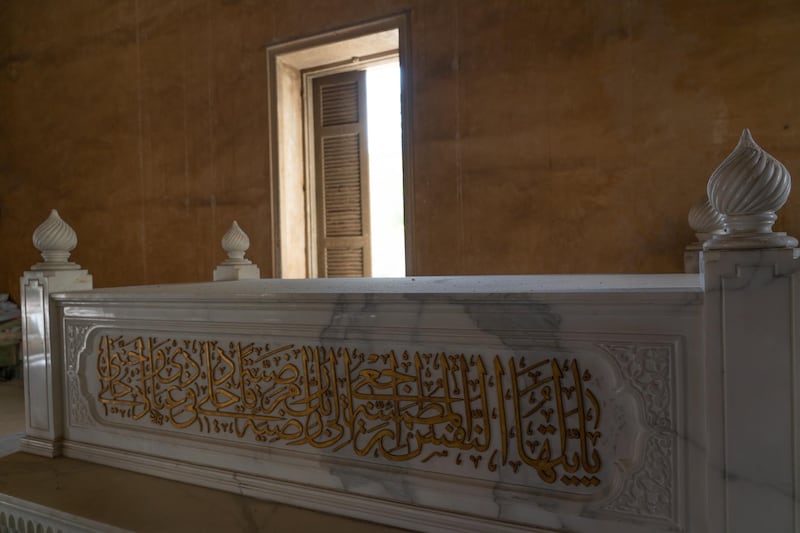 Intricate Islamic calligraphy is inscribed on a tomb above ground in the City of the Dead. Mahmoud Nasr / The National