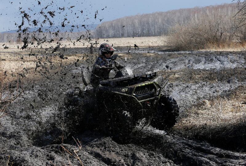 A rider competes during the 'Kings of the Off-road' quad bike amateur regional race in a Siberian boggy district near the 'Zagorie' balneological resort, southwest of Krasnoyarsk, Russia. Ilya Naymushin / Reuters