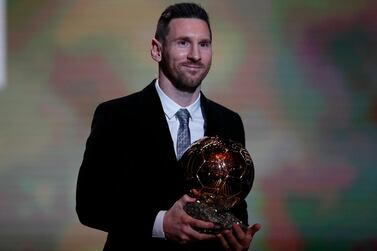 Barcelona footballer Lionel Messi holds the trophy of the Golden Ball award ceremony in Paris, Monday, December 2, 2019. Messi won the Ballon d'Or for sixth time. AP Photo/Francois Mori