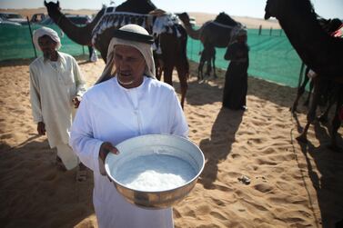 Fresh camel milk is kept in a large bowl for people to enjoy at a milking competition at the Camel Festival in Madinat Zayed in 2010. Galen Clarke / The National  