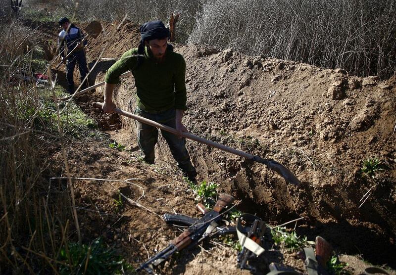 Fighters from the Free Syrian Army's Al Majd brigades digging a trench in the rebel-held besieged area of Al Marj in the Eastern Ghouta of Damascus, Syria on February 18, 2017. As ISIL's territory in Iraq shrinks, the extremist group has expanded into areas of Syria, such as Ghouta, in which its presence had been previously lighter. Bassam Khabieh/Reuters