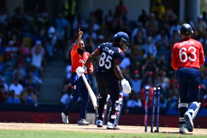 England spinner Adil Rashid celebrates after bowling USA's Aaron Jones for 10. AFP