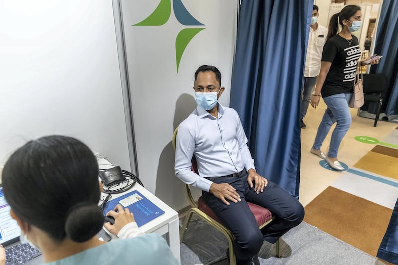 Mr Lateef Painatprepares to get vaccinated at the newly opened Al Barsha Hall, Vaccination Centre that are administering 4000 vaccinations a day on May 5th, 2021. Antonie Robertson / The National.Reporter: Nick Webster for National.