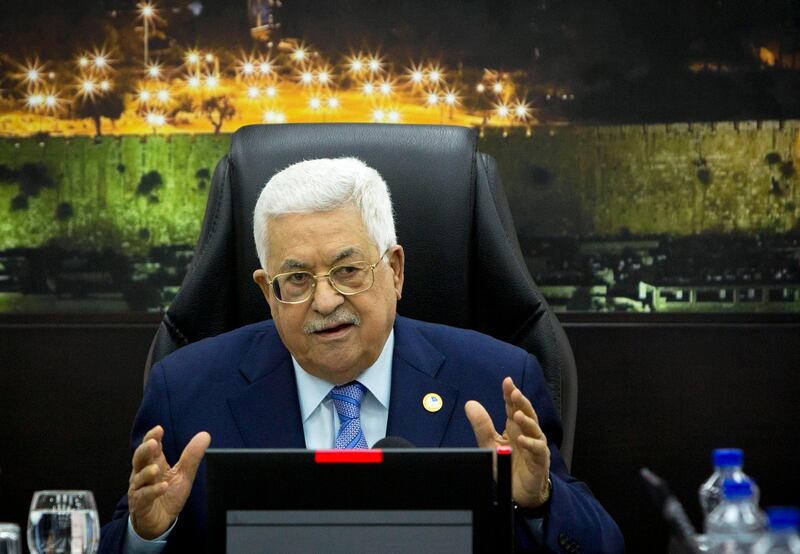 FILE - In this April 29, 2019 file photo, Palestinian President Mahmoud Abbas chairs a cabinet meeting in the West Bank city of Ramallah. Abbas laid off all of his advisers and ordered a former prime minister and other Cabinet officials to return tens of thousands of dollars they received from a pay raise he had secretly approved two years ago. Palestinian officials said the decisions, announced in official statements, Monday, Aug. 19, 2019, came as part of efforts to cut costs and recuperate funds after Israel stopped delivering tax revenues earlier this year. (AP Photo/Majdi Mohammed, Pool, File)
