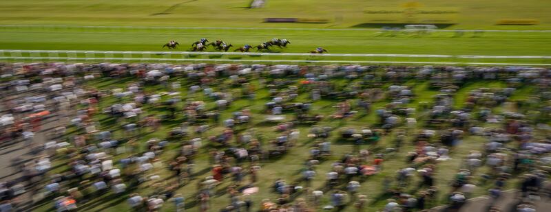 Runners and riders race towards the finish in the Dubai Duty Free Handicap at Newbury Racecourse in England on Saturday, September 18. Getty