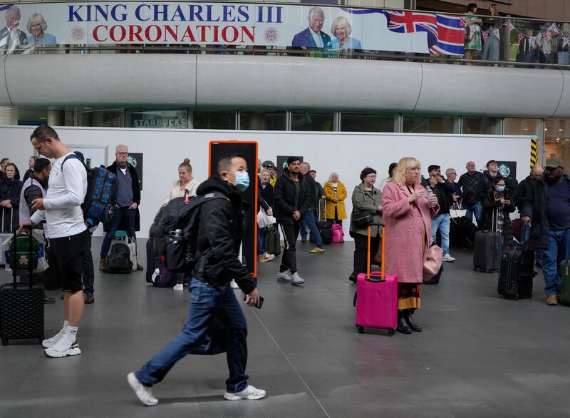 A banner celebrating the coronation at Kings Cross Station in London. AP