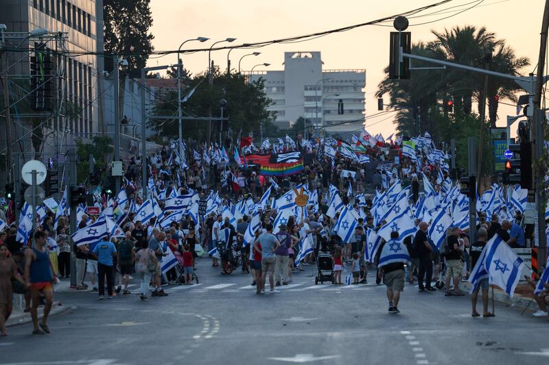 Israelis take part in a demonstration against Israeli Prime Minister Benjamin Netanyahu and his nationalist coalition government's judicial overhaul, in Tel Aviv. AFP