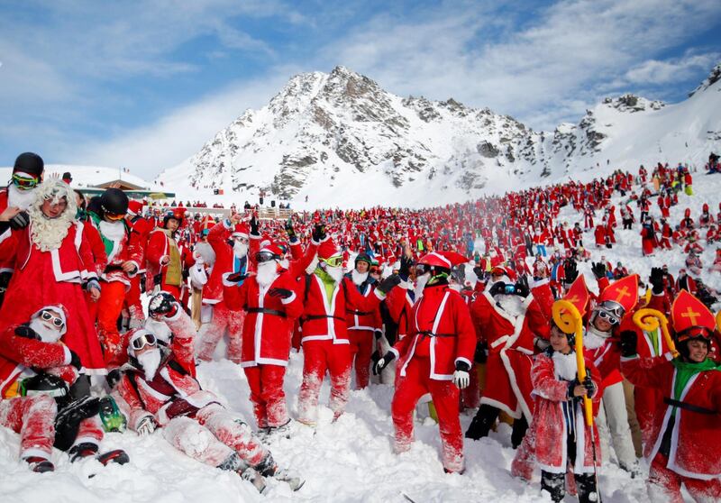 People dressed as Santa Claus enjoy the snow during the Saint Nicholas Day at the Alpine ski resort of Verbier, Switzerland. Denis Balibouse / Reuters