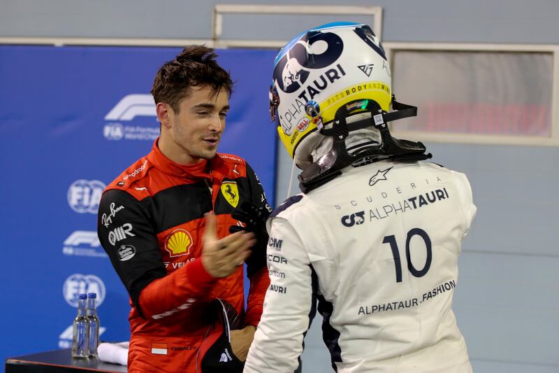 Ferrari's Charles Leclerc is congratulated by French driver Pierre Gasly of AlphaTauri Honda after taking pole position for the Grand Prix of Bahrain. EPA