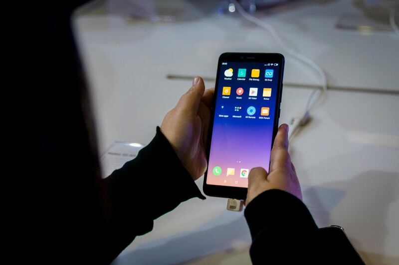 SANTIAGO, CHILE - DECEMBER 05: A visitor holds the Redmi S2 smartphone during the official launch of the Chinese brand Xiaomi on December 05, 2018 in Santiago, Chile. (Photo by Sebastian Vivallo OÃ±ate/Agencia Makro/Getty Images)