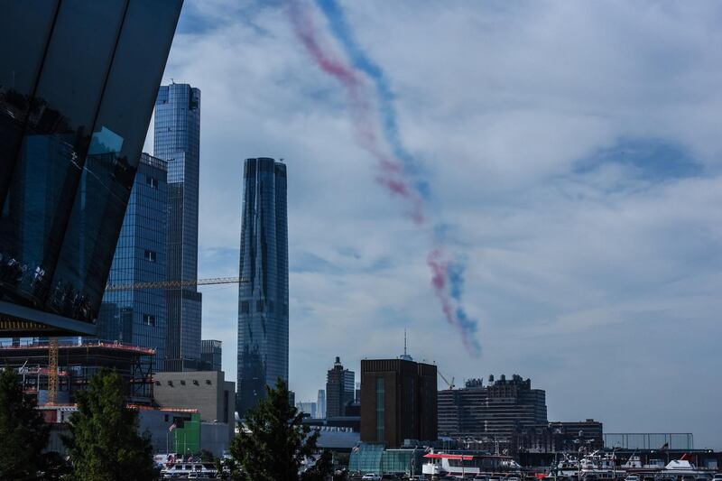 The remnant of the Royal Air Force Red Arrows signature red, white and blue smoke.  AFP